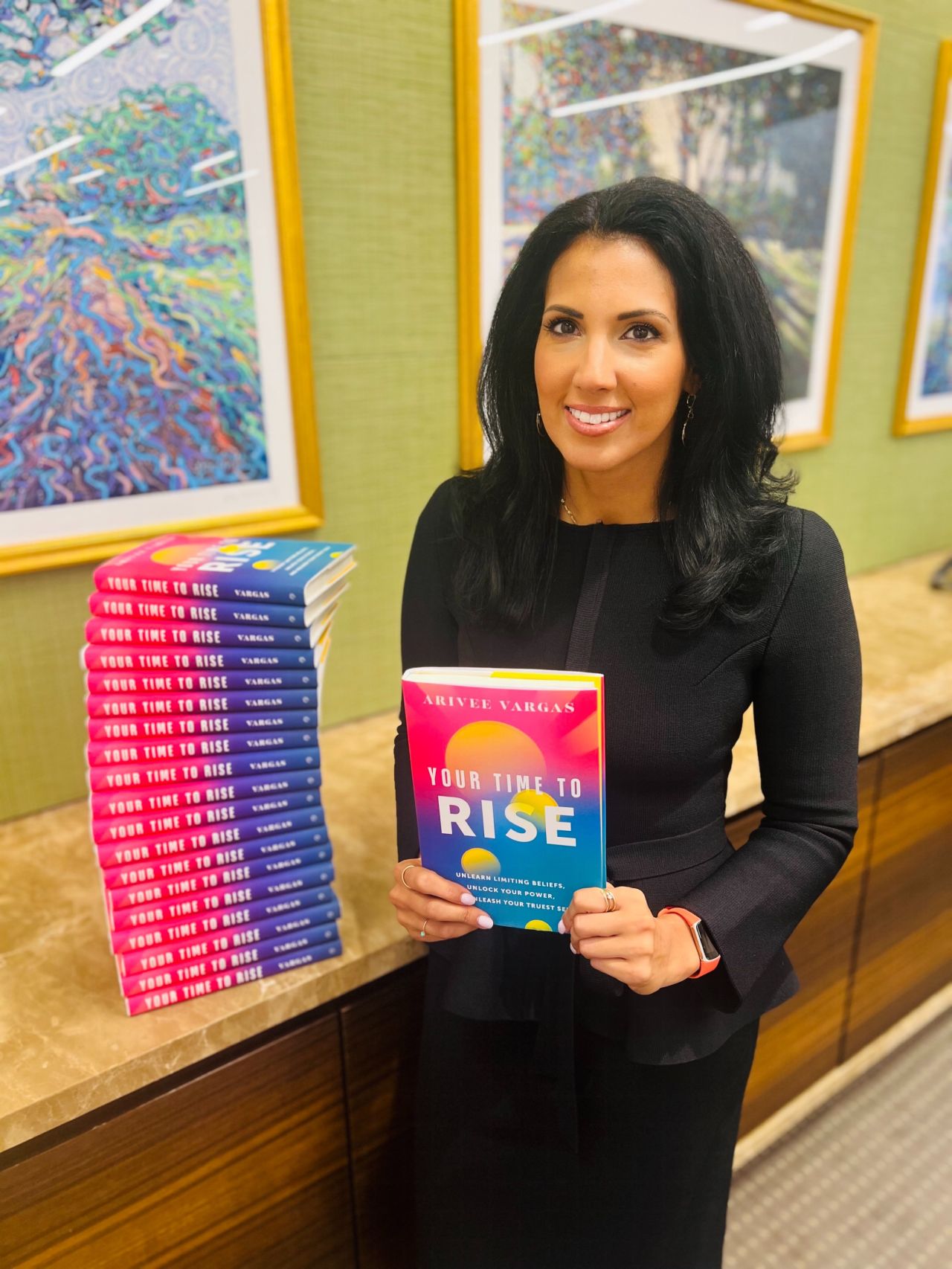 Arivee Vargas holding Your Time to Rise